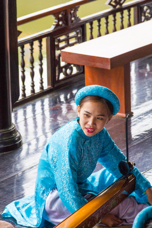 Woman playing traditional musical instrumentのeditorial素材