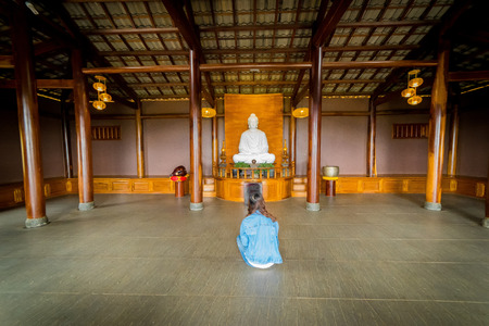 Young woman sitting in the pagodaのeditorial素材