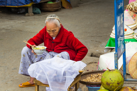 Old woman selling fruit in streetのeditorial素材