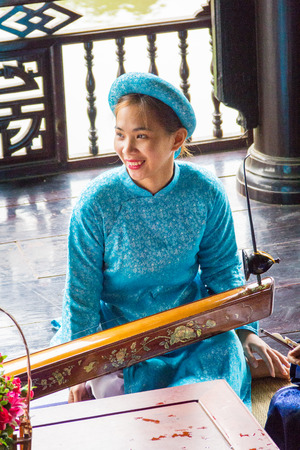 The young woman playing traditional musical instrumentのeditorial素材