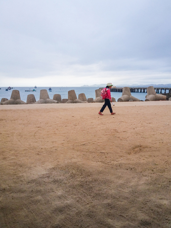 Girl go to school in beachのeditorial素材