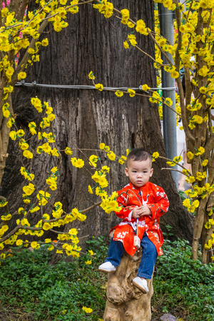 The boy wears happy new year's traditionalのeditorial素材