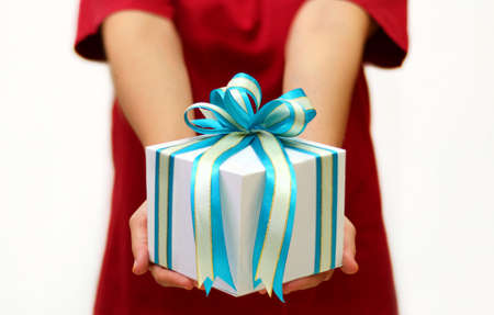 women in red holding gift box