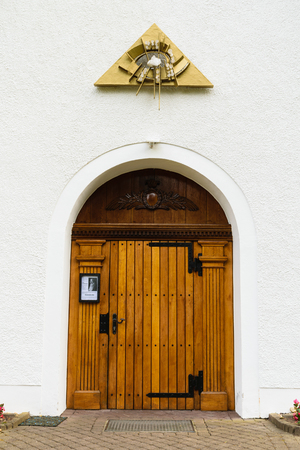 Koblenz - Germany, July 9, 2018: Close up of the wooden door of an isolated small church in Koblenz, Germanyのeditorial素材
