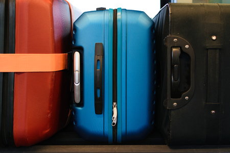 Travel concept, colorful plastic and fabric suitcasesの写真素材