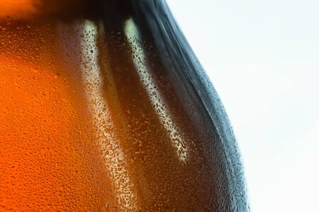 Close up of cold beer bottle isolated on white backgroundの写真素材