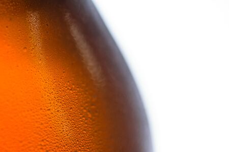 Close up of cold beer bottle isolated on white backgroundの写真素材