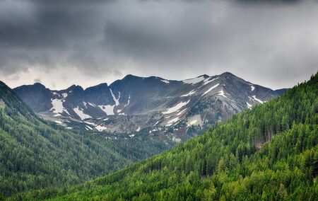 High mountain with snow in summer at Etrachsee, Austriaの写真素材