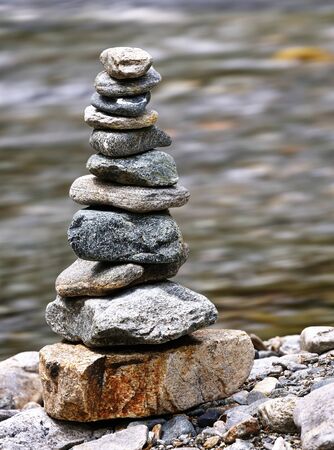 Stone balancing next to stream in Etrachsee, Austriaの写真素材