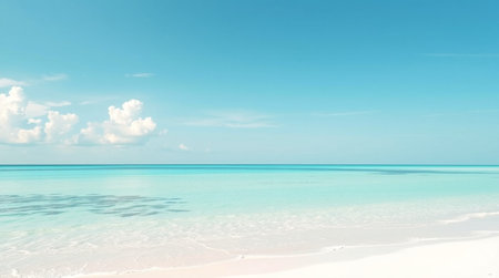 tropical beach with turquoise water and white sand under blue sky