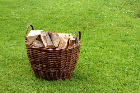Basket with firewood in the garden. Firewood concept.の写真素材
