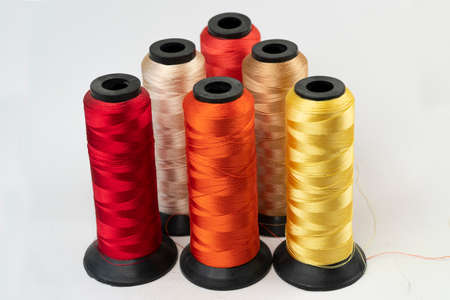 spools of thread on a white background, isolate, close-up