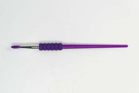 Purple knitting needles on a white background.の写真素材