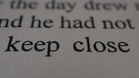 word keep calm printed on white paper macro close up view with soft focusの写真素材