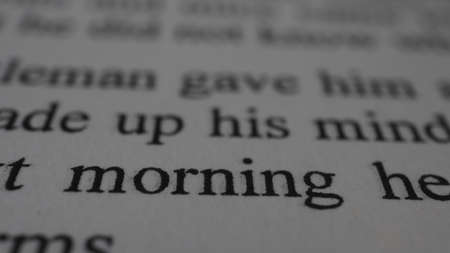 Macro shot of the word motherhood printed on white paper.の写真素材