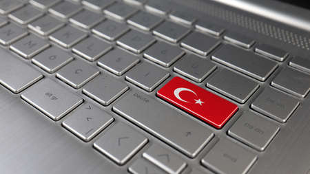 The national flag of Turkey on the laptop keyboard. Conceptual 3D renderingの写真素材