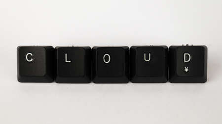 The word CLOUD written with black keyboard keys on white backgroundの写真素材