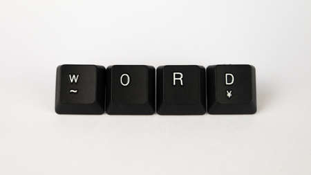The word written with black keyboard keys on white background.の写真素材