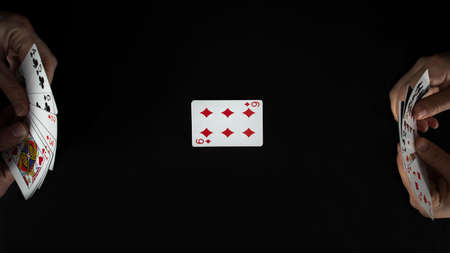 Playing cards on a dark background. The concept of the game of poker.の写真素材