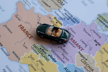 Miniature toy car on the map of Spain.