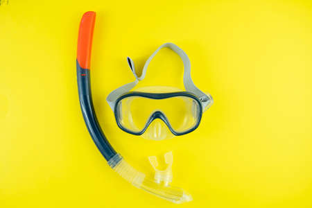 Snorkeling mask and snorkel on yellow background.の写真素材
