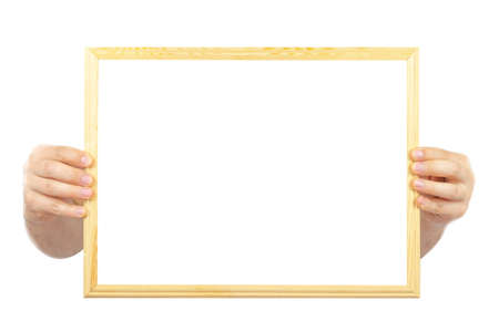 Wooden frame in hand isolated on white background. Copy space.の写真素材