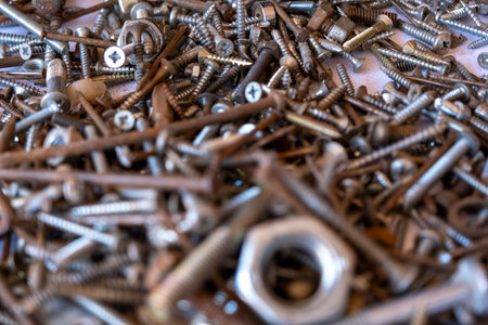 Close up of a pile of screws and bolts. Selective focus.の写真素材
