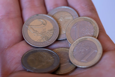 Euro coins in hand close-up. Euro currency. European currency.の写真素材