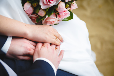Gentle Hand of the Bridegroom in the Brides Handの写真素材