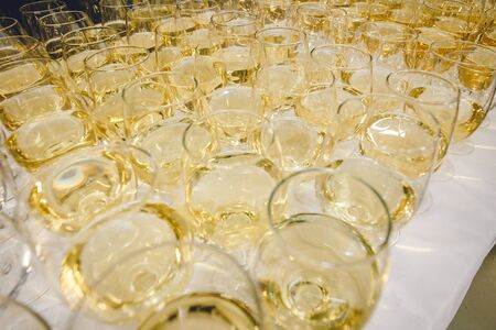 A lot of glasses of white champagne in a luxurious atmosphere view from above. Stylish photo of...