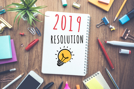 2019 New year resolution concepts with text on notebook and accessories work table.Human performanceの写真素材