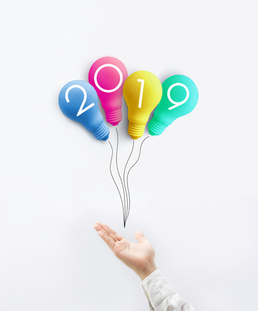 2019 creativity inspiration concepts on lightbulb balloon with human hand.Business solution,planning ideas.glowing contentsの写真素材