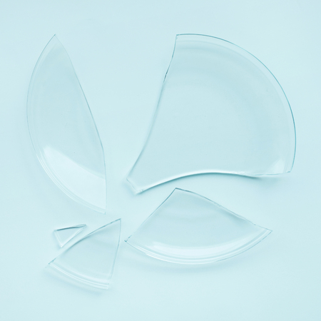 Broken plate,dish on pastel backgroundの写真素材
