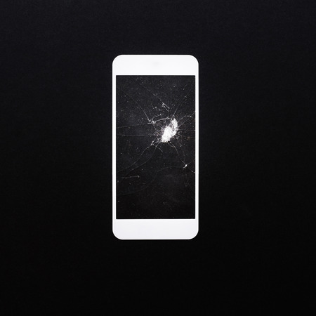 Tempered glass shield or film screen cover broken on black color.mobile phone protector concepts ideasの写真素材