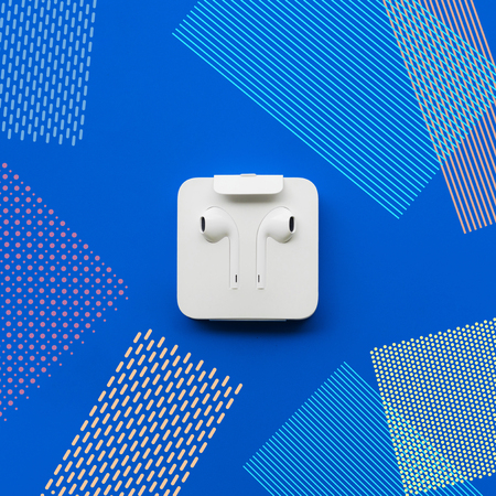 Earphone with memphis art on blue pastel color.listen musical concepts