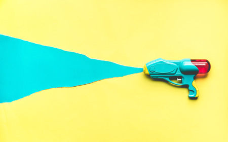 Colorful of water gun on color paper background.Refreshing and holiday summer idea concepts