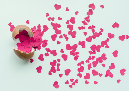 Egg with red heart shape paperon white background.love,valentine,wedding concepts ideasの写真素材