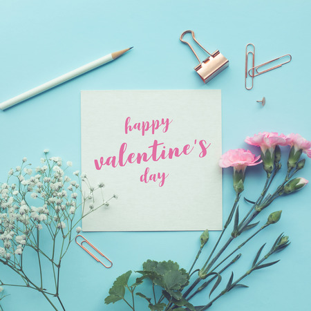 Happy valentineâ€™s day white paper space with flower on pastel color background.Flat...