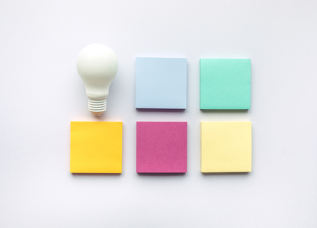 Creativity inspiration concepts with lightbulb and notepaper in colorful