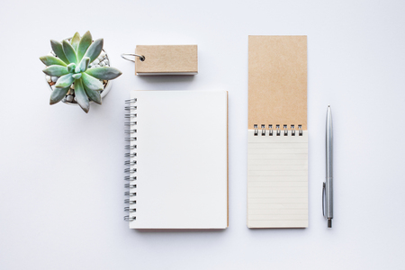 Business table top with mock up office supplies on white background.Flat lay design.Copy spaceの写真素材