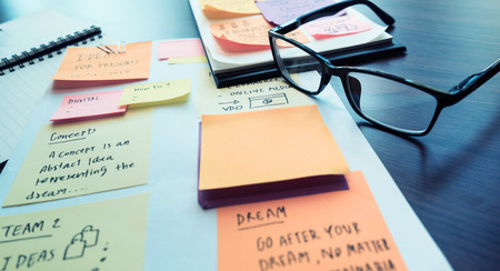 Marketing strategy concept with paperwork (note paper).brainstorming solution ideas.
