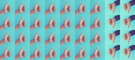 Differentiation or Effect result concepts with hand showing thumb up presents like and dislike,positive or negative sign on blue background.Business communication marketing,Motivation ideasの写真素材
