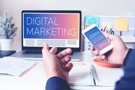 Digital marketing or communication concepts with young person work with computer laptop and smartphone on worktable.Business strategy analysisの写真素材