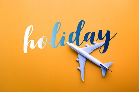 Holiday concepts with model plane,airplane on pastel color background.Flat lay design.の写真素材