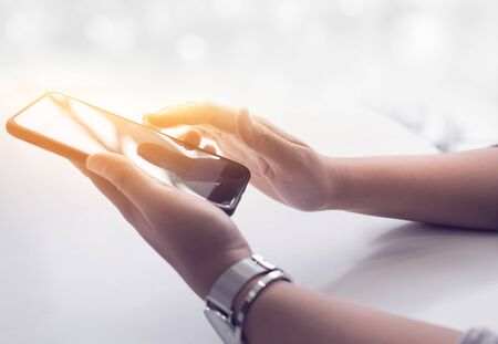 Close up female hand  holding smartphone