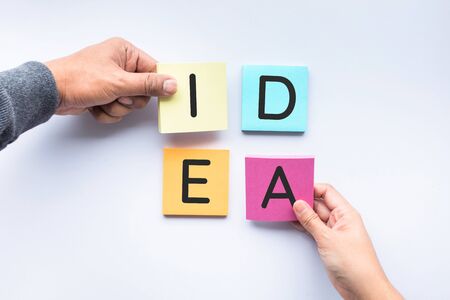 Male and female hand with notepaper color background.business brainstorming  and creativity idea conceptsの写真素材