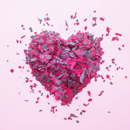 Confetti in heart shape decoration on colorful background.Love concepts.flat lay styleの写真素材