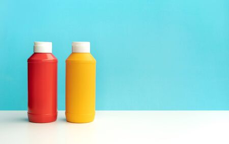 Bottles sauce( ketchup, mustard )on colorful bar counter background.の写真素材