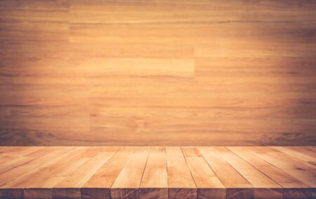 Empty wood table top on wood wall background.For montage product display or design key visual layout
