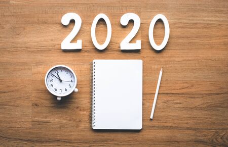 Celebration and countdown of new year 2020 concepts with text number and alarm clock and notepaper...
